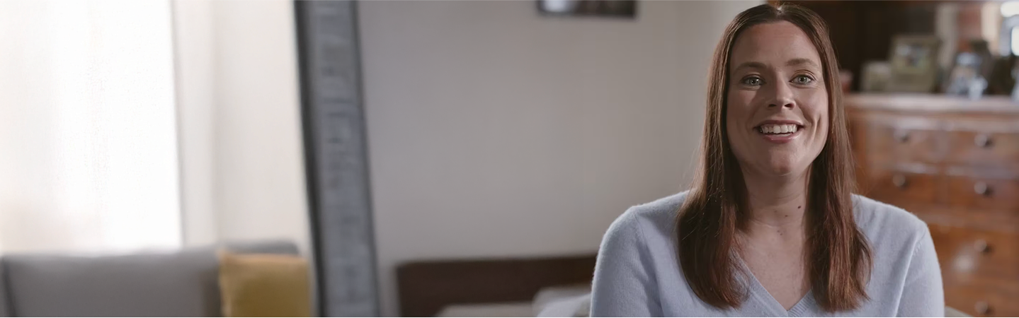 Woman smiling.