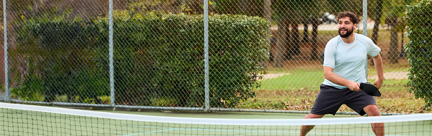 Man playing pickleball.