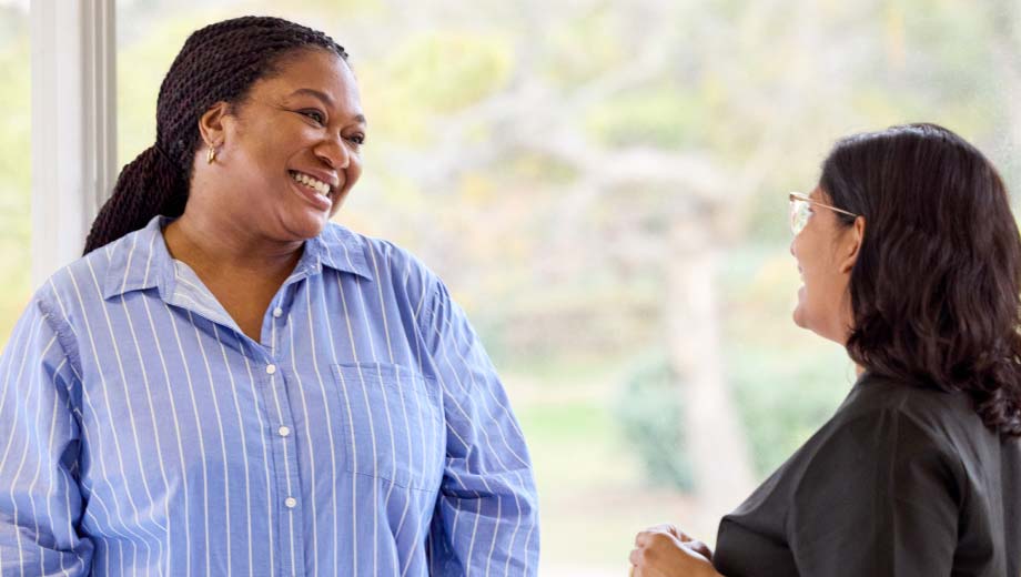 Woman speaking with healthcare provider.